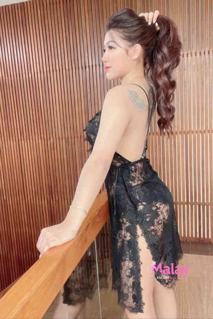 Malay Escort Service Woman in black lace lingerie poses on a wooden staircase KL Escort Girl Malay Escort KL Real KL Escorts Ready for You Malay Escort Service Woman in black lace lingerie poses on a wooden staircase KL Escort Girl