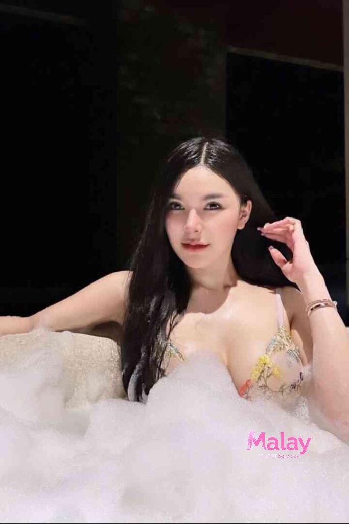 Malay Escort Service Woman in bubble bath with floralpatterned top KL Escort Girl Malay Escort KL Real KL Escorts Ready for You Malay Escort Service Woman in bubble bath with floral patterned top KL Escort Girl