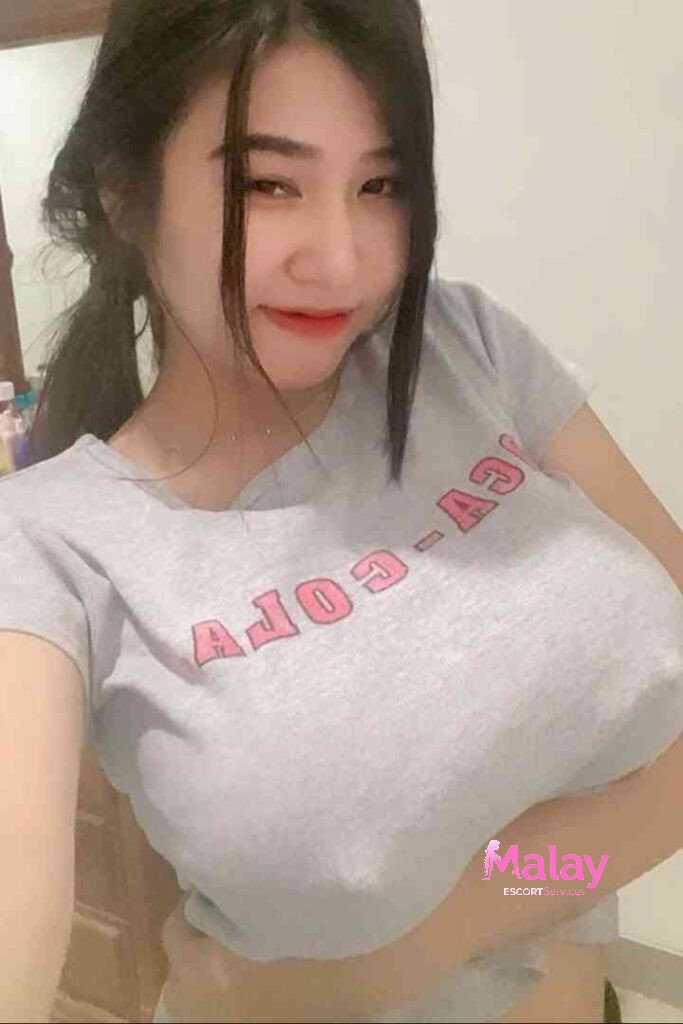 Malay Escort Service Young woman in a gray tshirt with CYCOPY text smiling KL Escort Girl Malay Escort KL Real KL Escorts Ready for You Malay Escort Service Young woman in a gray t shirt with CY COPY text smiling KL Escort Girl