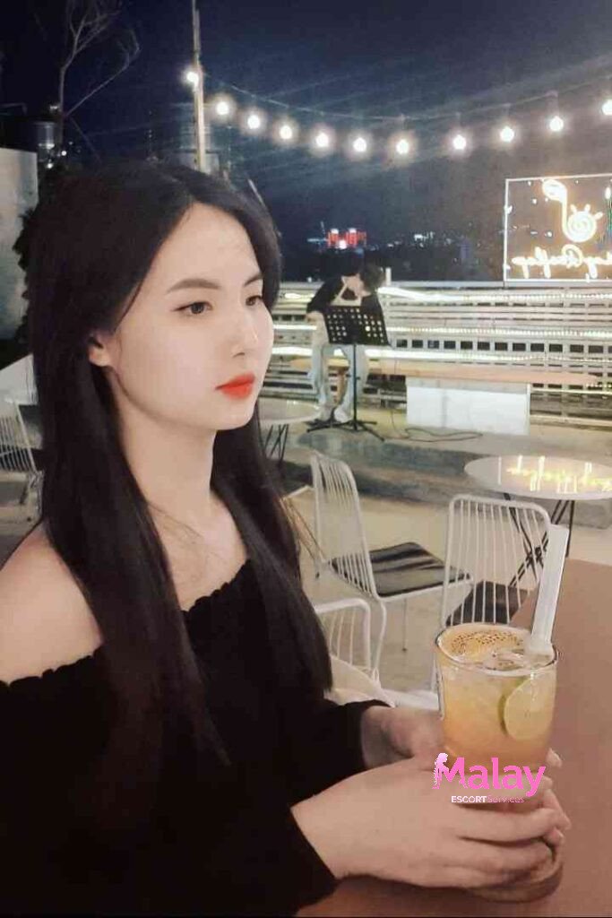 Malay Escort Service Young woman with long dark hair and a black offtheshoulder top holds a refreshing drink with lime KL Escort Girl Malay Escort KL Real KL Escorts Ready for You Malay Escort Service Young woman with long dark hair and a black off the shoulder top holds a refreshing drink with lime KL Escort Girl