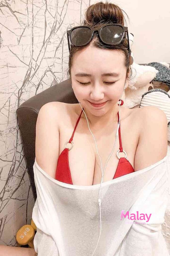 Malay Escort Service Woman in red bikini top and white offshoulder shirt with headphones and sunglasses KL Escort Girl Malay Escort KL Real KL Escorts Ready for You Malay Escort Service Woman in red bikini top and white off shoulder shirt with headphones and sunglasses KL Escort Girl
