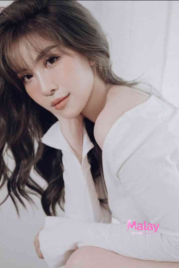 Malay Escort Service Young woman with wavy brown hair and bangs wearing a white offtheshoulder shirt looking to the side KL Escort Girl Malay Escort KL Real KL Escorts Ready for You Malay Escort Service Young woman with wavy brown hair and bangs wearing a white off the shoulder shirt looking to the side KL Escort Girl