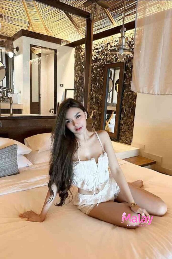Malay Escort Service Young woman in white lingerie relaxing on a bed in a tropical resort room KL Escort Girl Malay Escort KL Real KL Escorts Ready for You Malay Escort Service Young woman in white lingerie relaxing on a bed in a tropical resort room KL Escort Girl
