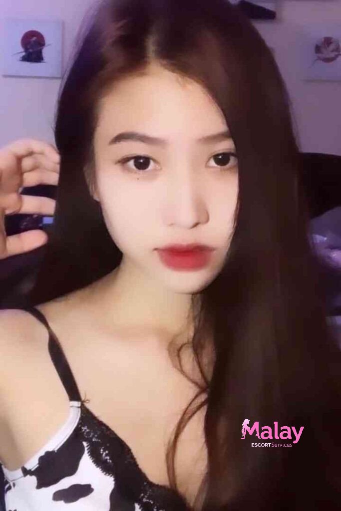 Malay Escort Service Young woman with long dark hair and red lipstick KL Escort Girl Malay Escort KL Real KL Escorts Ready for You Malay Escort Service Young woman with long dark hair and red lipstick KL Escort Girl