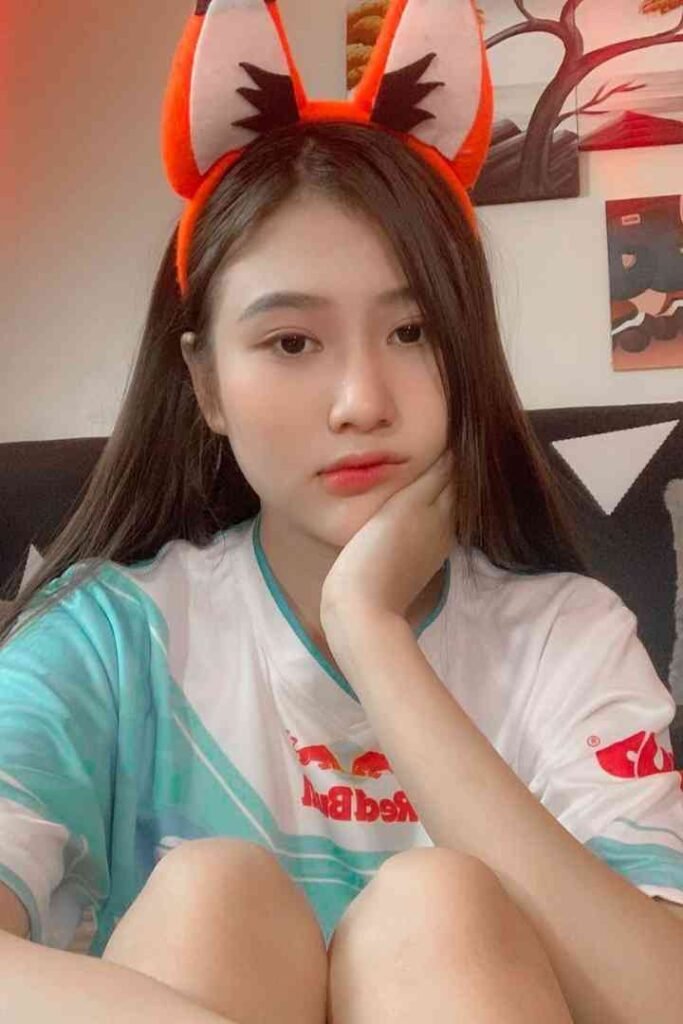 Malay Escort Service Young woman with fox ears headband wearing a t shirt with red bull logo KL Escort Girl